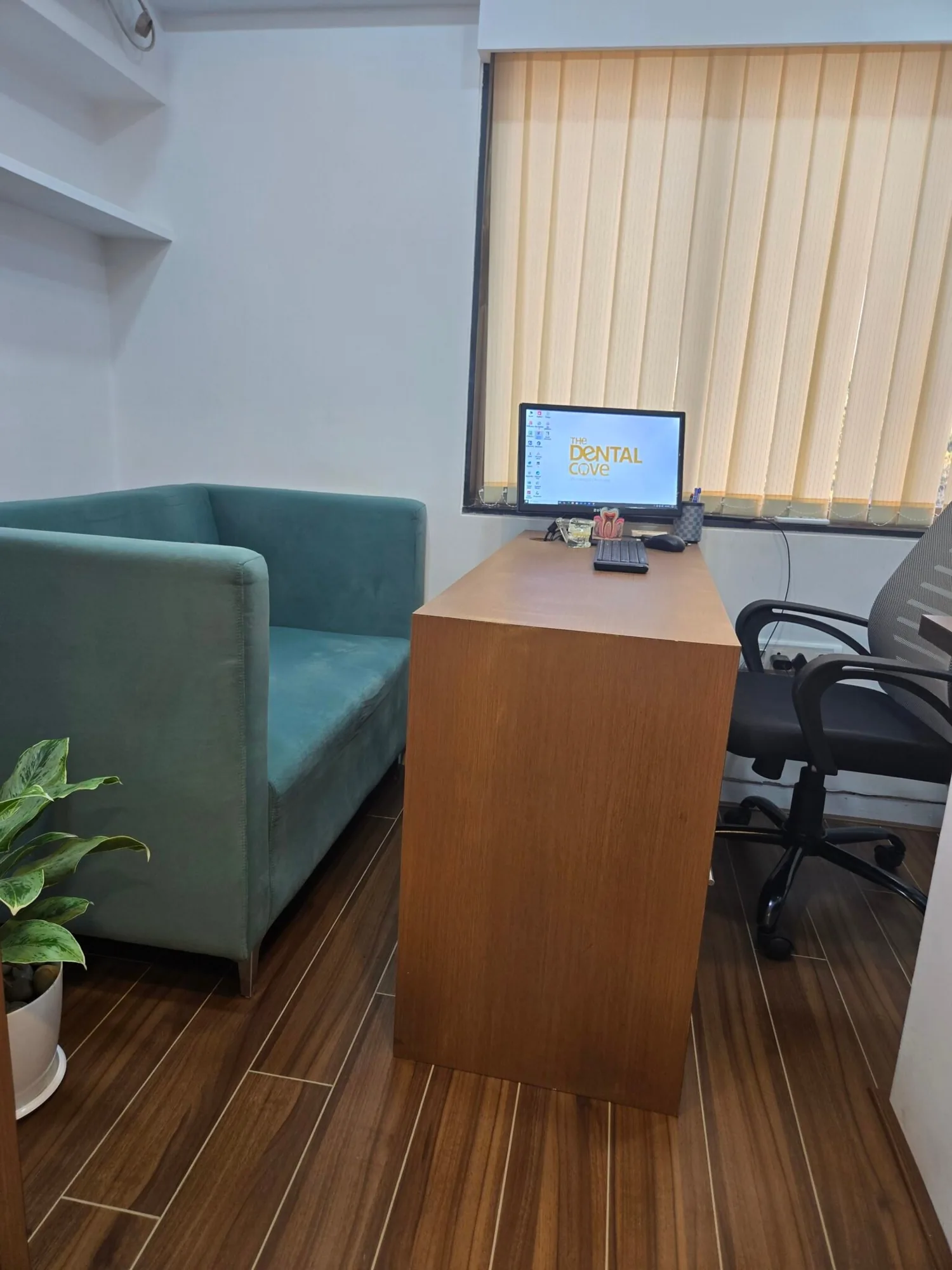 Consultation room at The Dental Cove with a dental chair beside a large window